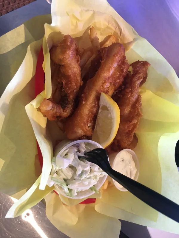 Crispy golden buffalo hot chicken wings in a basket